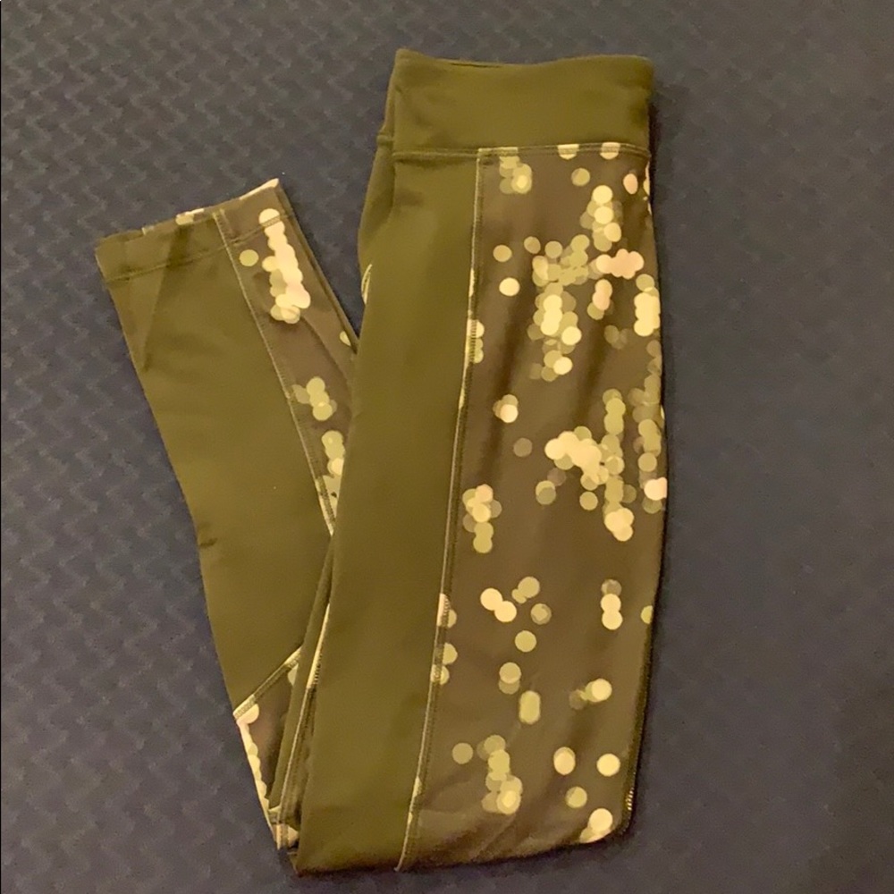Green Under Armour leggings with white dots